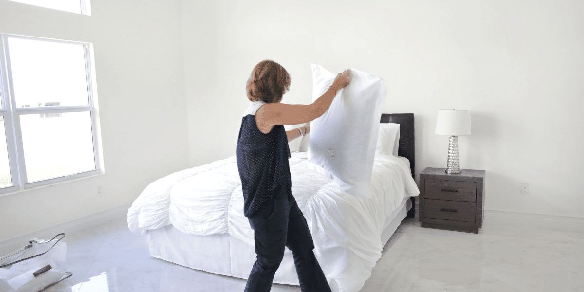 Woman making bed