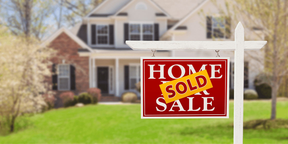 House with sold sign in front yard