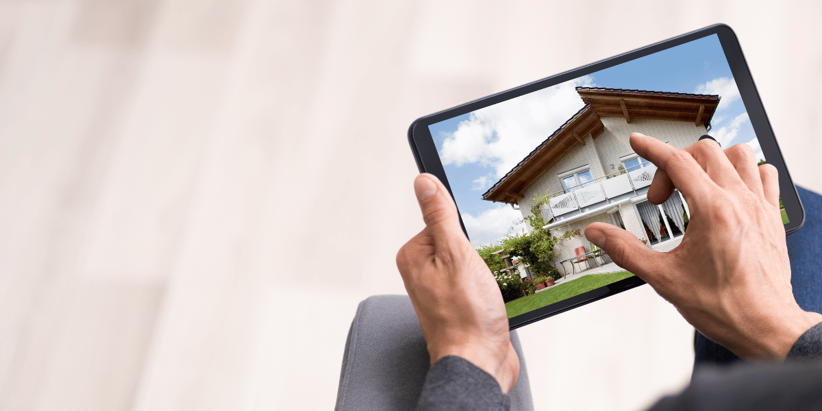 A person utilizing newer technology in the form of a tablet to perform a property search