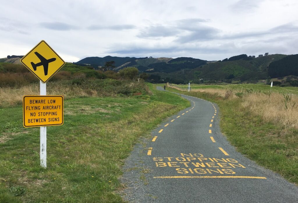 House with a 'for sale' sign in the yard.