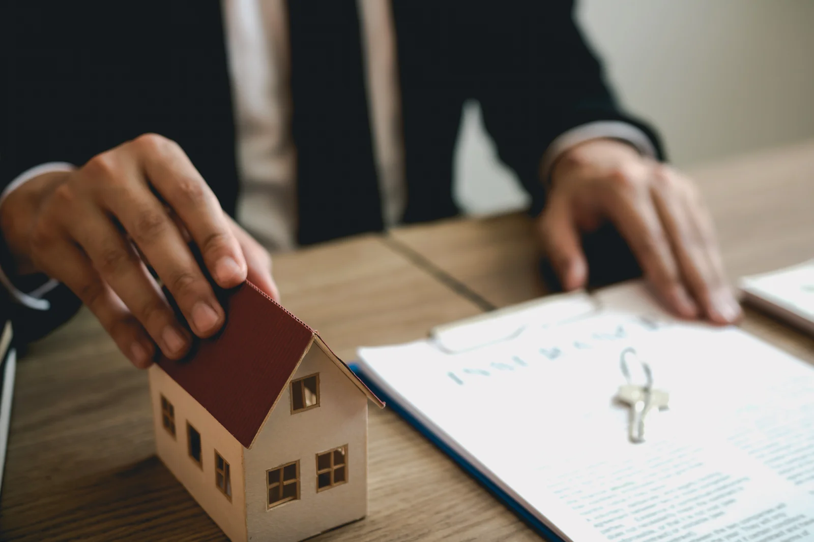 Real estate agent discussion about signing on paper financial contract at office agency