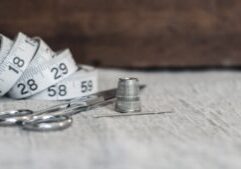 Close-up of neat stacks of cash next to house keys on a bright, minimalist surface, symbolizing significant savings in a r...